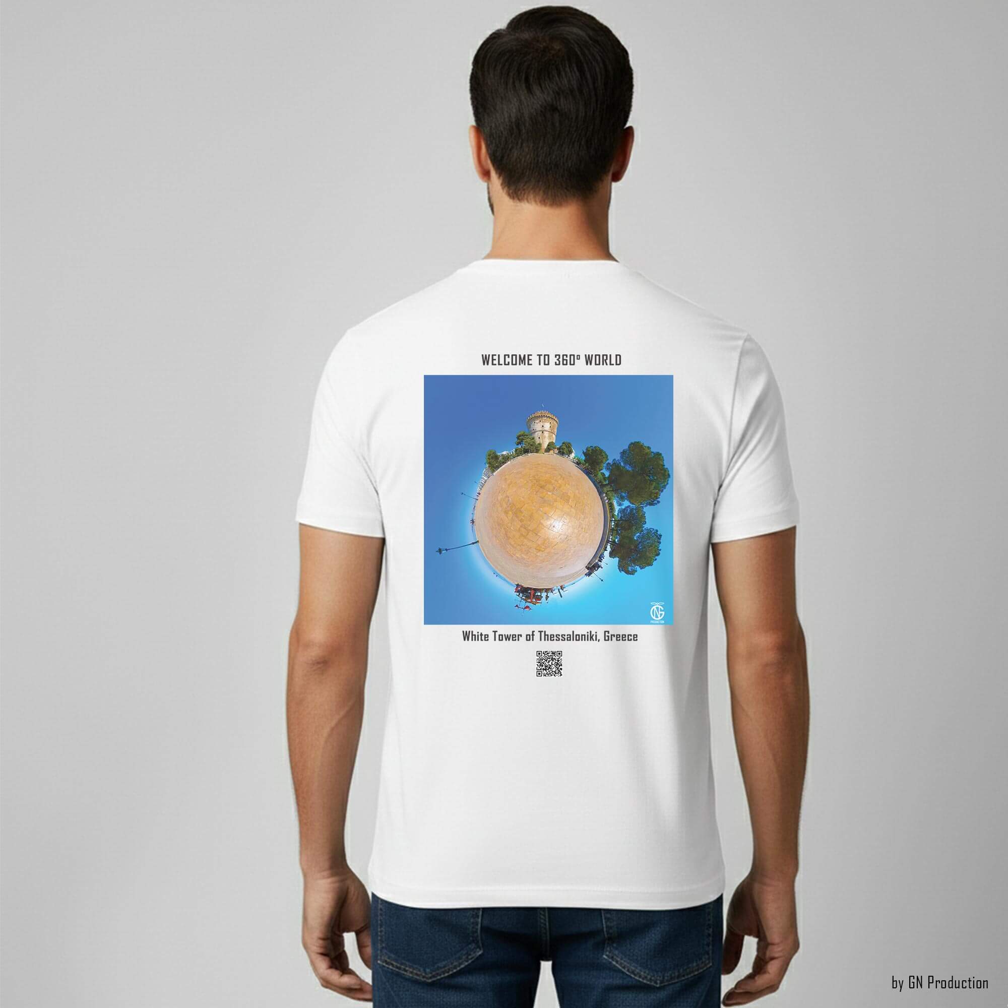 Man model wearing white art T-shirt with White Tower of Thessaloniki tiny-planet 360° print on back, Greek city landmark