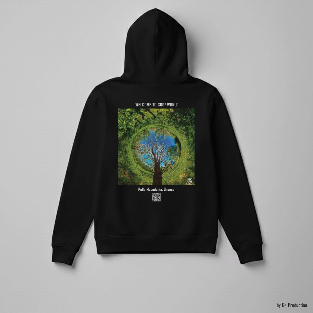 Black GN Production hoodie laid flat, back print of Pella Macedonia inverted tiny-planet 360° cherry orchard with central tree forming circular floral composition.