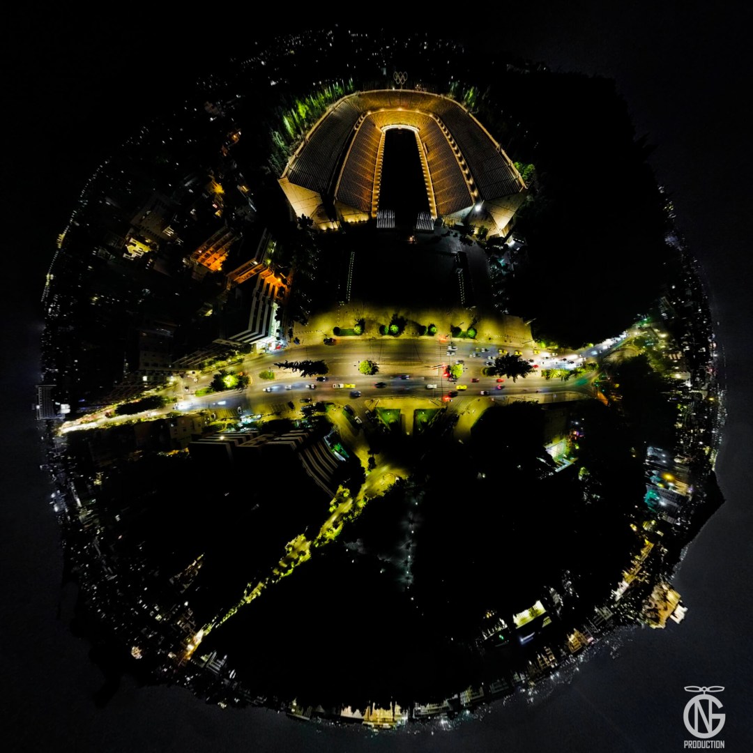Night tiny-planet 360° view of the Panathenaic Stadium (Kallimarmaro) and Vasileos Konstantinou Ave, Athens, Greece.