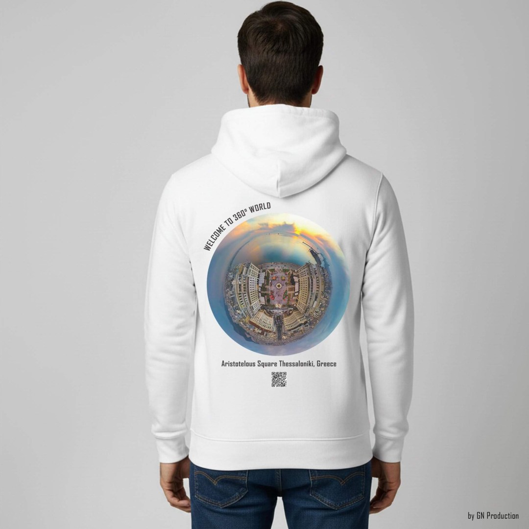 Man wearing a white GN Production hoodie featuring Aristotelous Square Thessaloniki Christmas Edition golden-hour tiny-planet 360° artwork with illuminated festive square and sea backdrop.