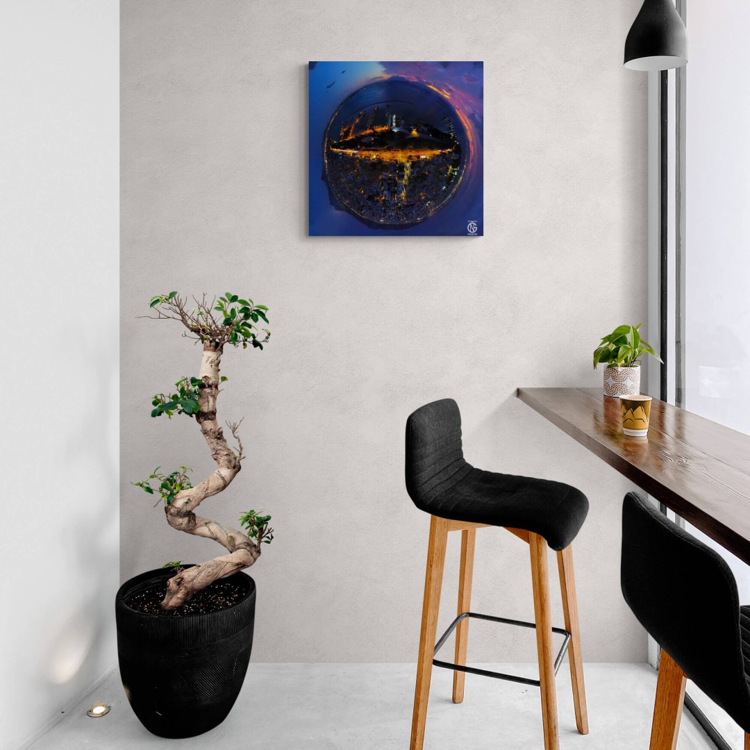 Night-drone tiny-planet canvas of Aretsou Marina hanging in a modern café.