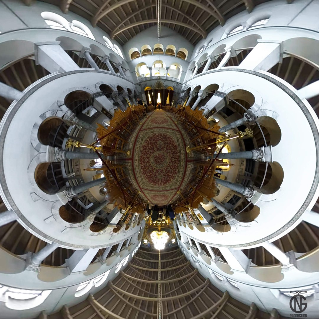 Interior tiny-planet 360° view of Saint Demetrius, the patron saint of Thessaloniki: marble colonnades, arches and chandelier forming a symmetric orb.