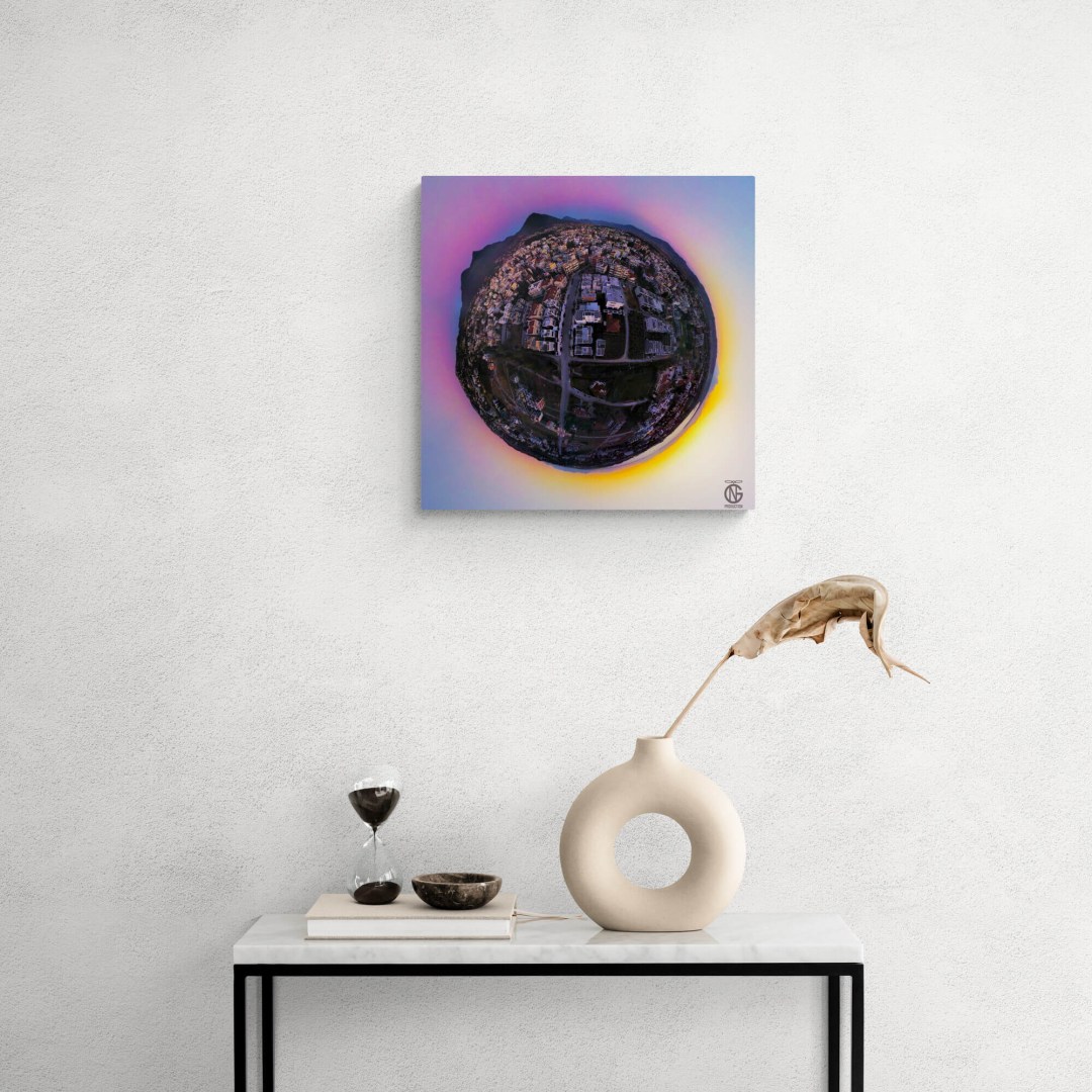 Close view of the Thermi sunset tiny-planet 360° canvas on a console beside a sculptural vase.